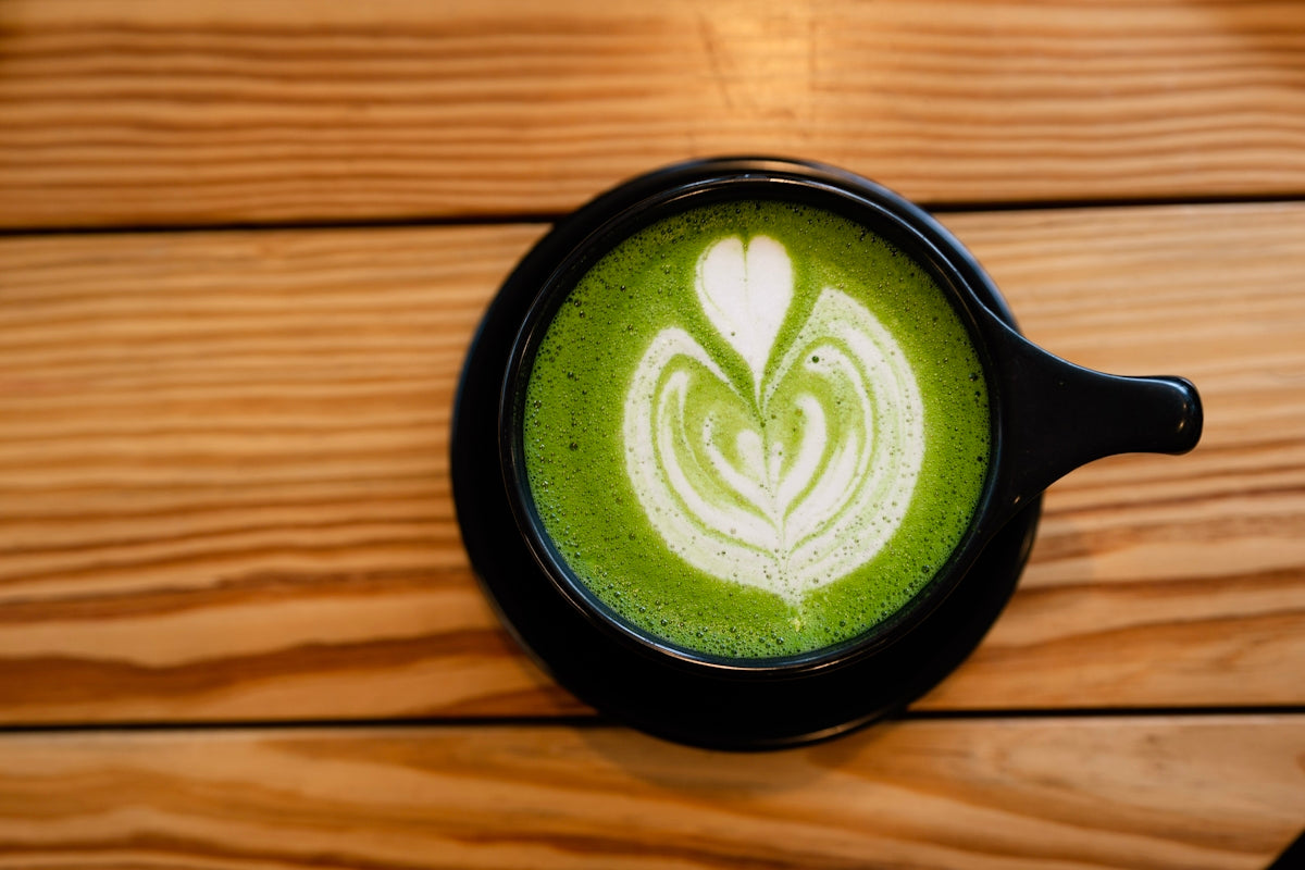 latte on black ceramic mug