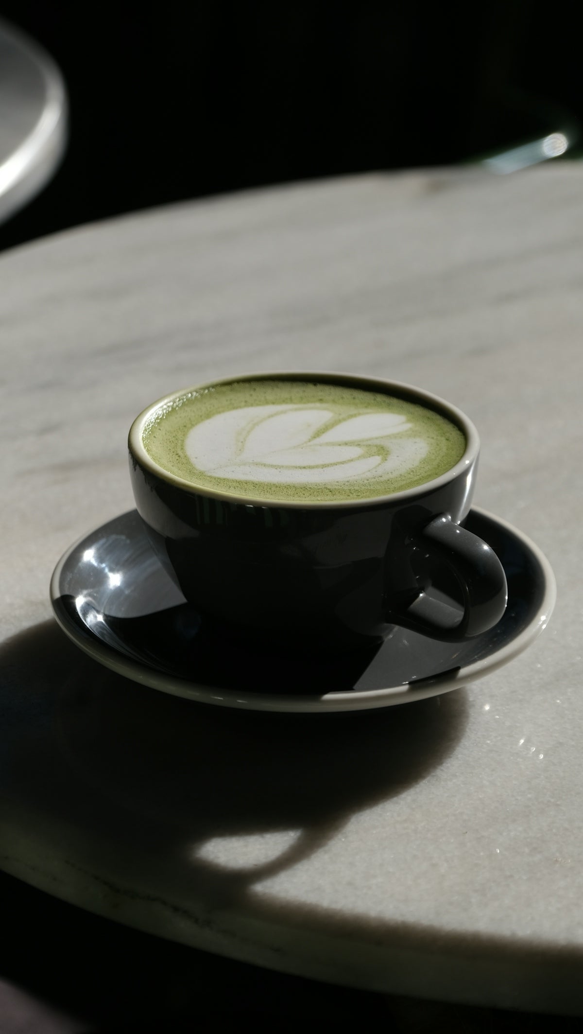 Matcha latte with artistic foam.