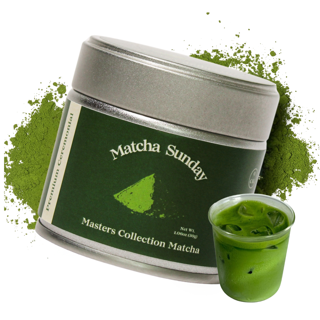 Matcha Sunday Masters Collection ceremonial matcha tin beside a glass of iced matcha latte on a green powder splash